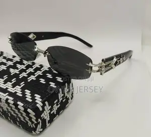 Prada Rimless Sunglasses With Gold-Tone Accents.
