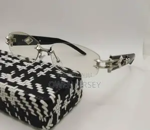 Prada Rimless Sunglasses With Gold-Tone Accents.