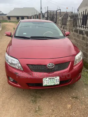 Toyota Corolla XLE 4dr Sedan (1.8L 4cyl 4A) 2010 Red