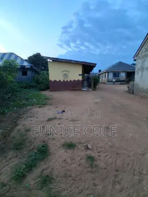 Half Plot of Land Inclusive of a School Building