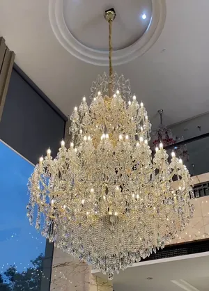 A Large Luxury Multi-Tier Crystal Chandelier With a Gold Finish