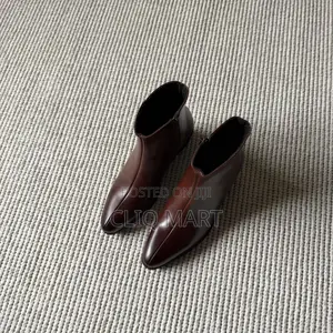The Heeled Leather Lined Ankle Boot Available in Black and Brown Color
