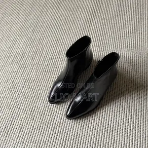 The Heeled Leather Lined Ankle Boot Available in Black and Brown Color