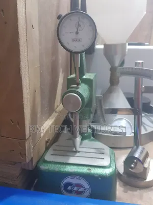 Device Shown Is a Precision Dial Comparator Stand (Or Bench Thicknes