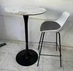 Round Bistro Bar Table Features a White Marble-Patterned Top Set