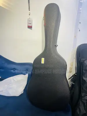 Soft-Shell Acoustic Guitar Case Featuring a Black Textured Exterior