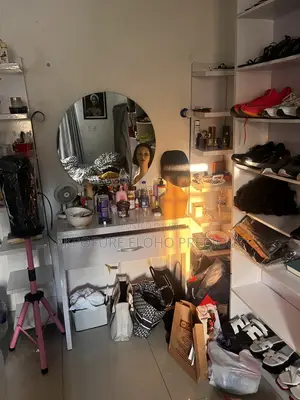 White Vanity Table With Two Rack by the Side and Mirror