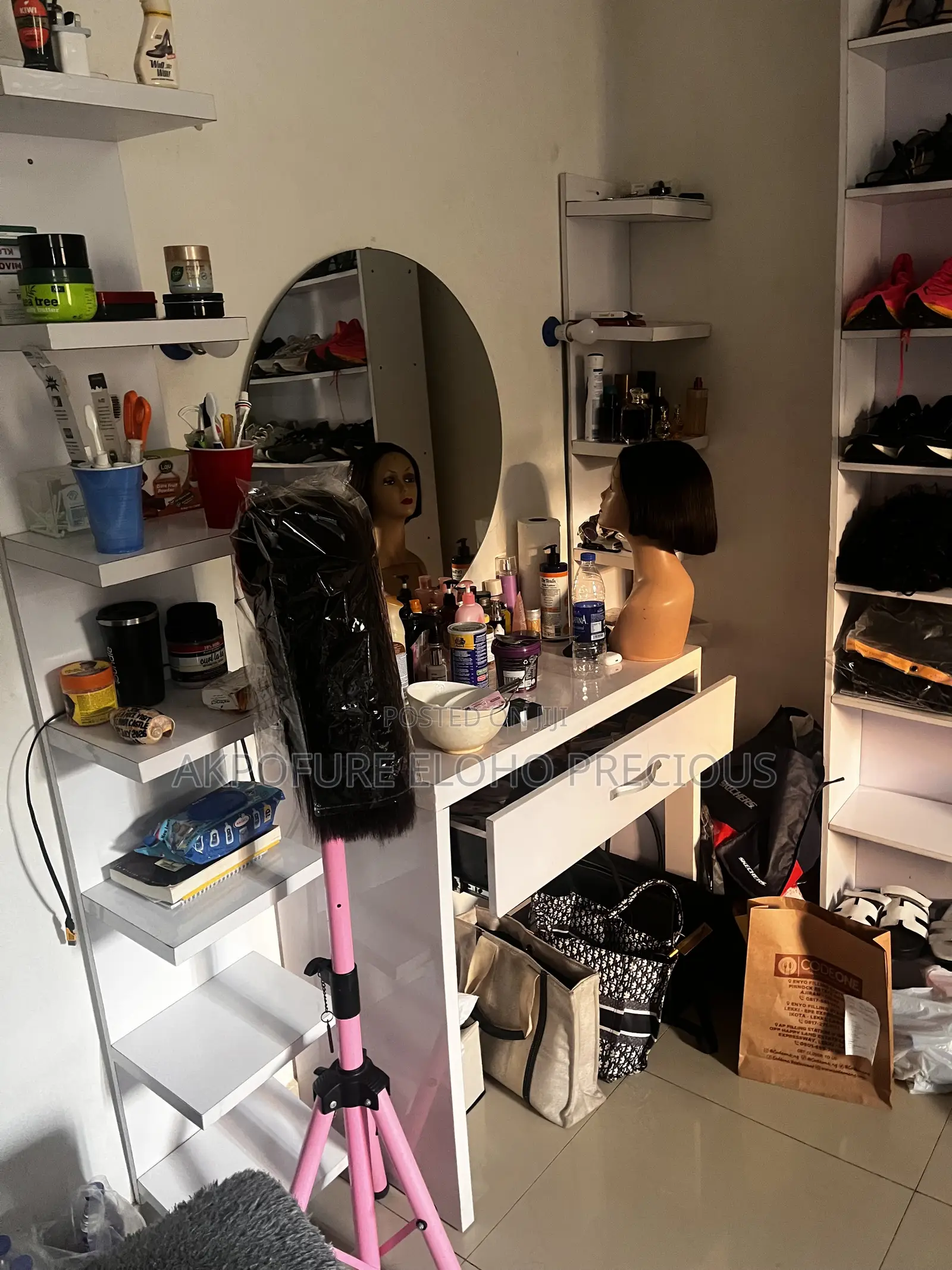 White Vanity Table With Two Rack by the Side and Mirror