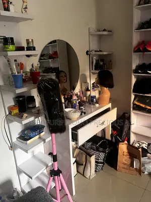 White Vanity Table With Two Rack by the Side and Mirror