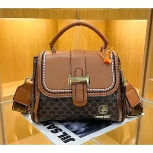Fox Jazz Structured Top-Handle Handbag Features a Beige Patterned Bod