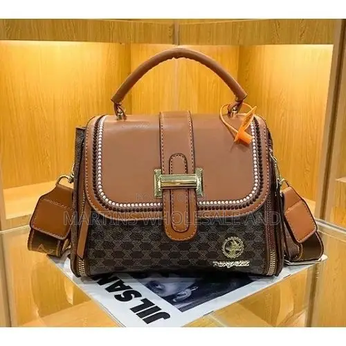Fox Jazz Structured Top-Handle Handbag Features a Beige Patterned Bod