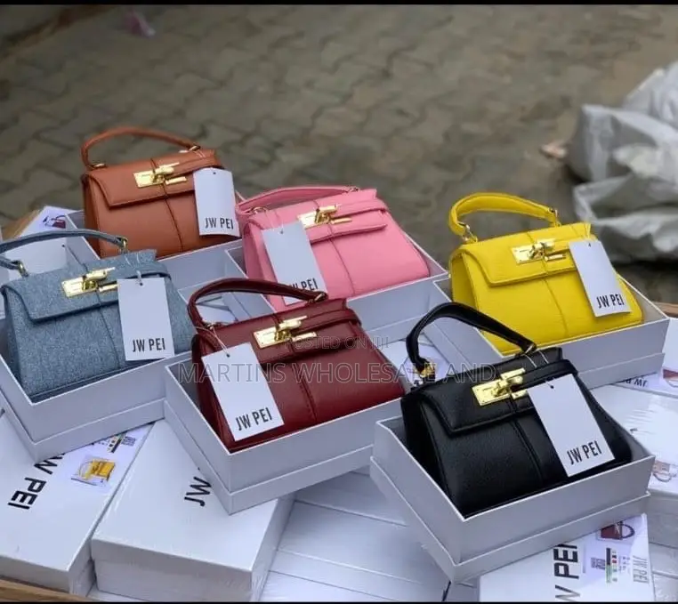 JW Pei Structured Top-Handle Handbags Feature a Distinctive Padlock-In