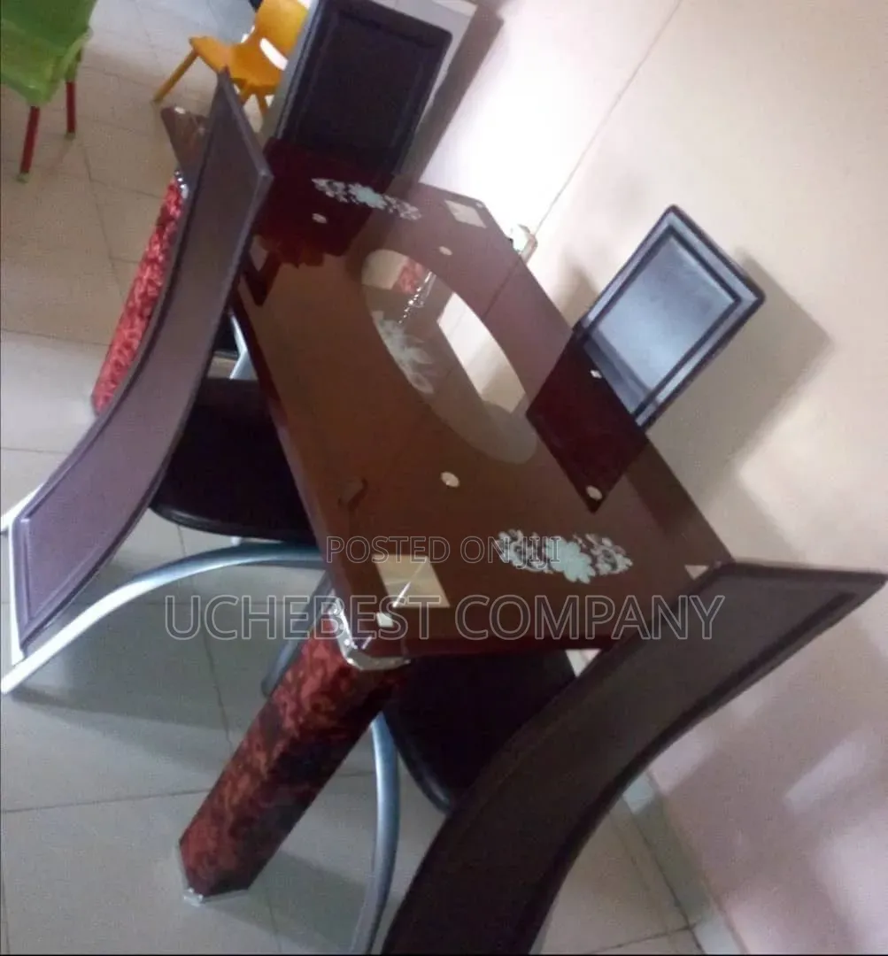 Glass Dinning Table by 6 Chairs Available