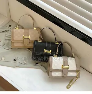 Chic Structured Handbag Features a Classic Checkered Pattern Accented
