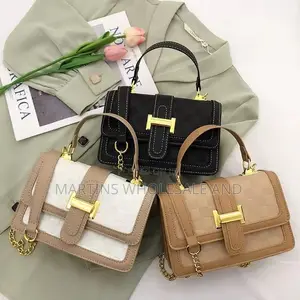 Chic Structured Handbag Features a Classic Checkered Pattern Accented