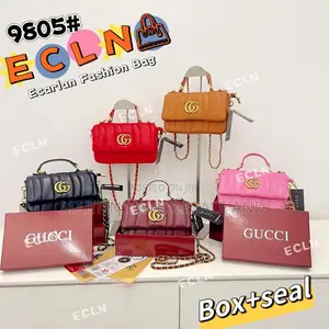 Reproductions of the Gucci GG Milano Mini Top Handle Bag.