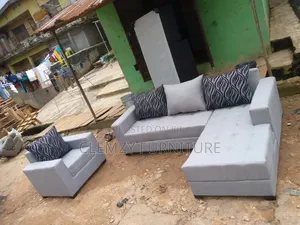 Gray Color L Shape Sofas Plus a Single Seater