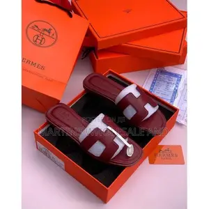 Hermes-Style Flat Slide Sandals Feature the Iconic Cutout "H" Strap De