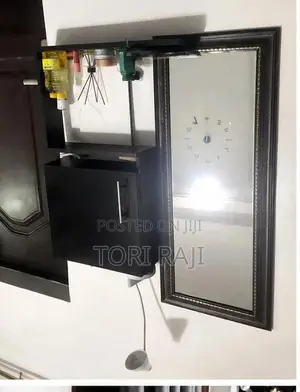 Neatly Used Mirror and Shelf Set