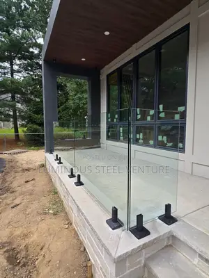 This Glass-Tampered Balcony Wall Was Constructed Using a Black Spigot.