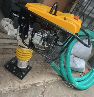 Shows a Gasoline-Powered Tamping Rammer, Also Known as a Jumping Jack