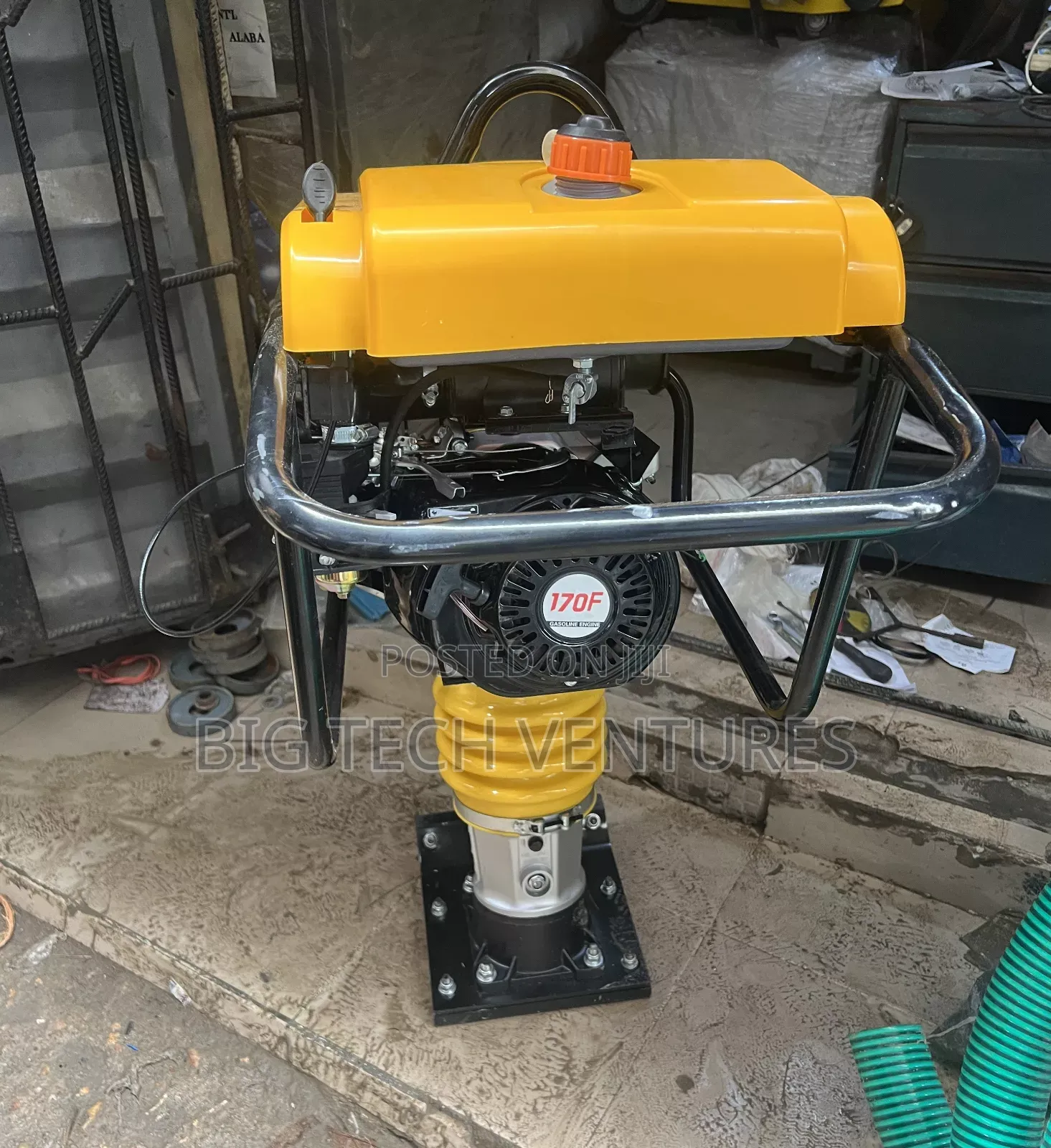 Shows a Gasoline-Powered Tamping Rammer, Also Known as a Jumping Jack