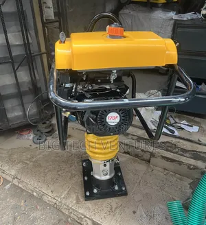 Shows a Gasoline-Powered Tamping Rammer, Also Known as a Jumping Jack