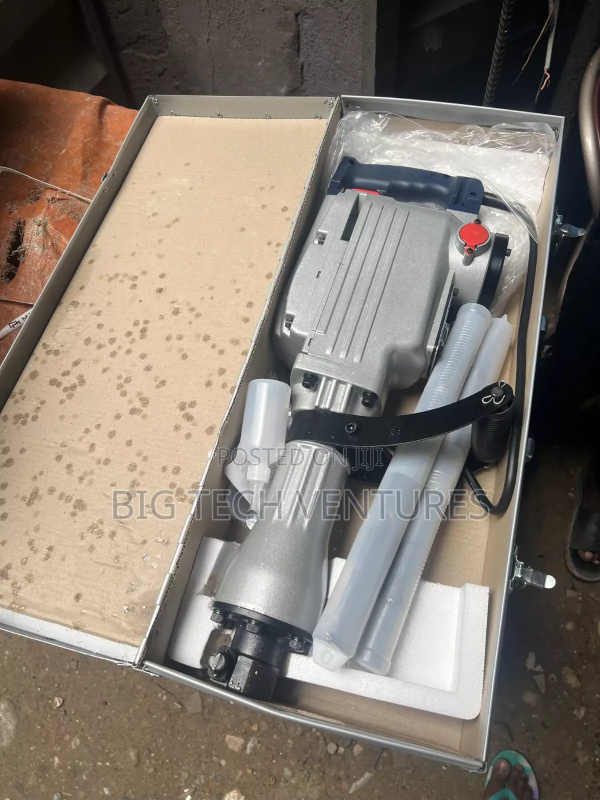 Shows a Heavy-Duty Electric Demolition Breaker (Jackhammer),