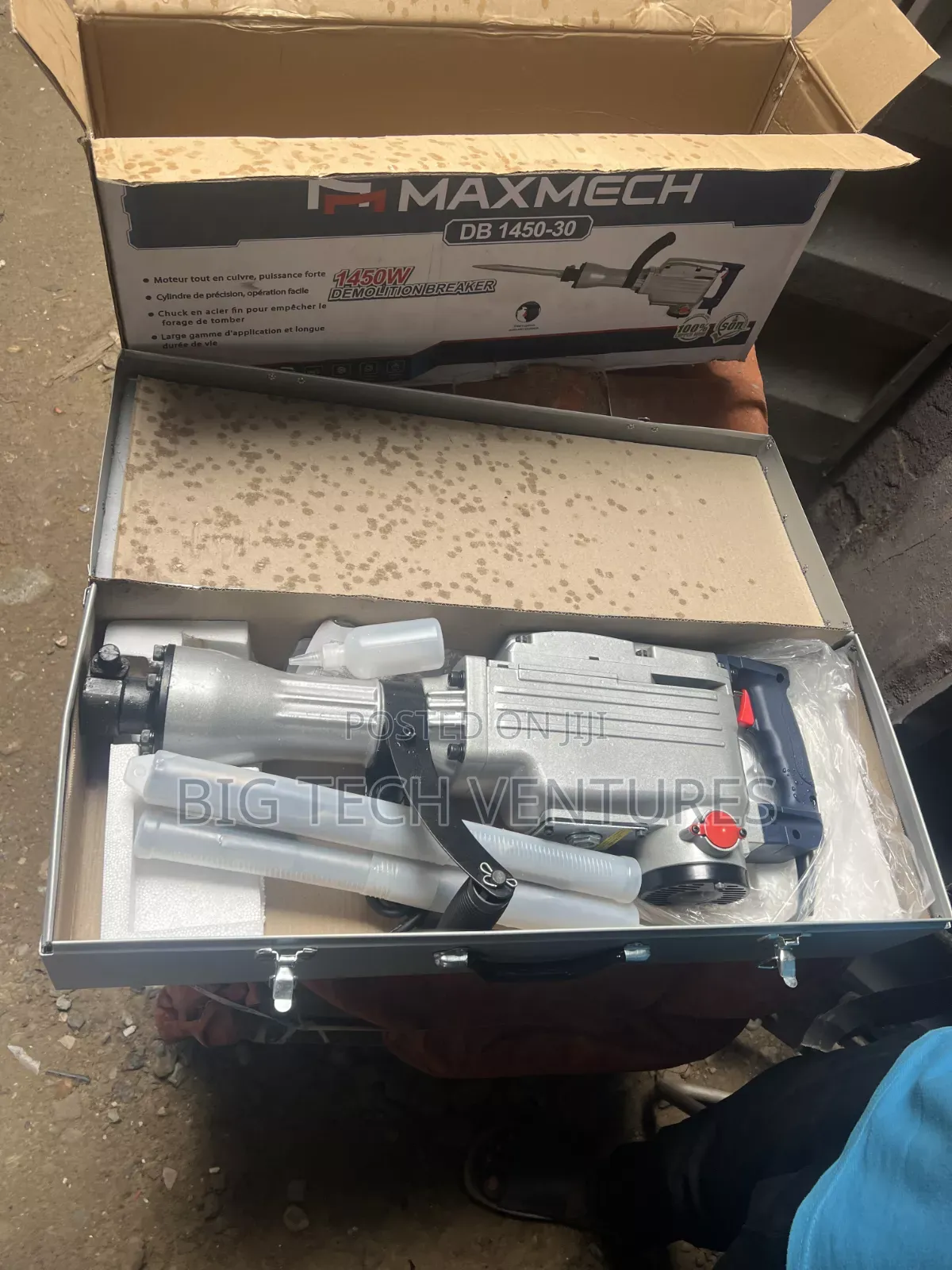 Shows a Heavy-Duty Electric Demolition Breaker (Jackhammer),