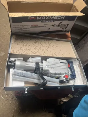 Shows a Heavy-Duty Electric Demolition Breaker (Jackhammer),