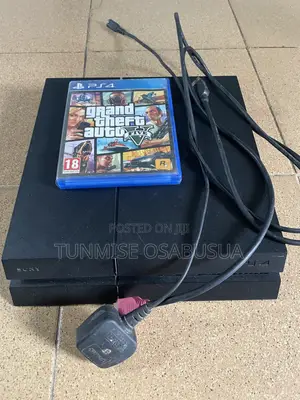 A Barely Used Ps4 With No Pads but With Power Cable, HDMI and Gta 5 Cd