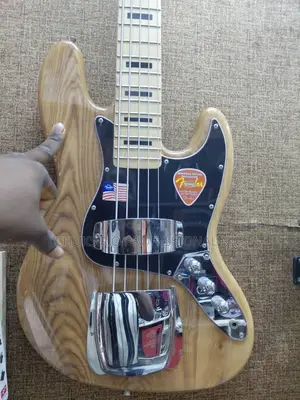 Fender Jazz Bass Guitar - 4 String, Natural Wood Finish