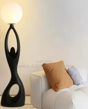 Humanoid Sculpture Globe Floor Lamp