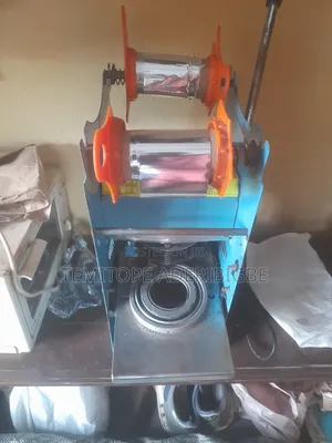 A Cup Sealing Machine.