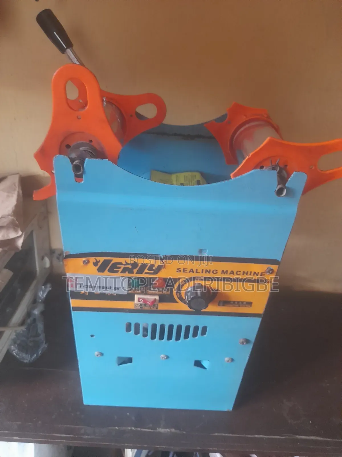 A Cup Sealing Machine.
