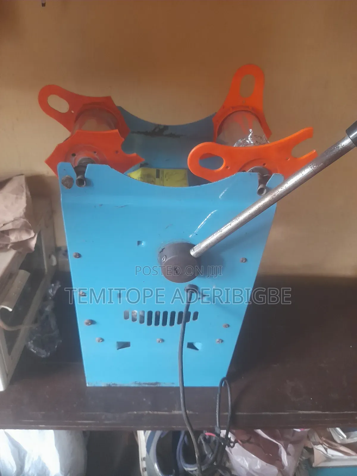 A Cup Sealing Machine.
