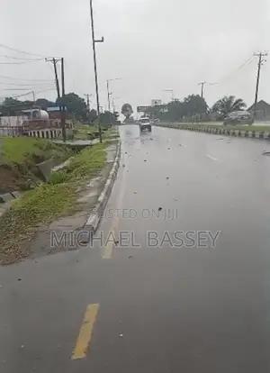One and a Half Plot of Land for Sale at Highway