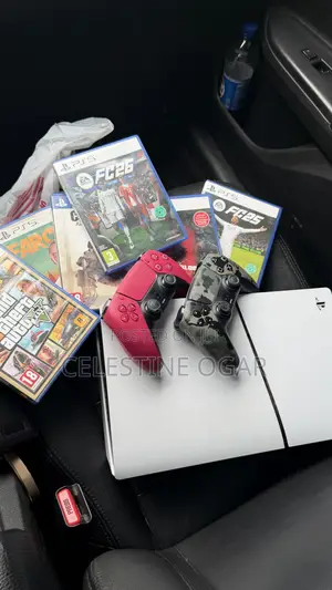PS5 Slim With 2 Pads and 6 Video Game Discs.