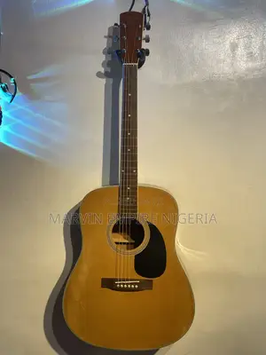 A Natural-Finish Dreadnought Acoustic Guitar With Bag
