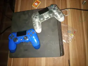 Ps4 Slim Working Prefect and Good With Five Games on It and Two Pad