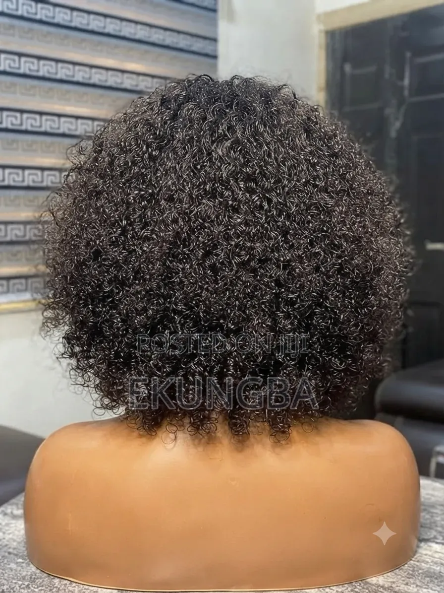 Kinky Curly Bob With Bangs.