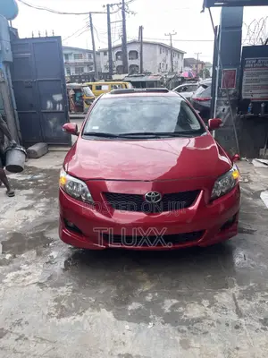 Toyota Corolla Base 4dr Sedan (1.8L 4cyl 5M) 2010 Red