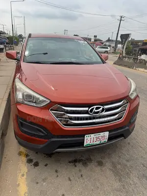 Hyundai Santa Fe GLS 4dr SUV AWD (3.3L 6cyl 6A) 2015 Orange