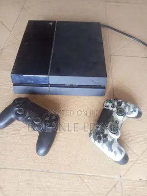 Title: Nigerian Used PS4 Fat 500GB + 2 Pads + FC Game