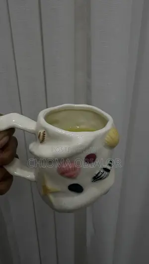 Asymmetrical White Ceramic Seashell Mug Featuring a Charming Starfish