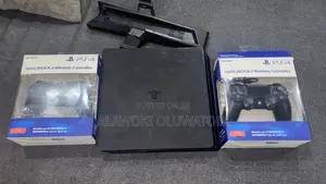 PS4 Slim 500Gb With 2 Controllers and a Controller Charger With Stand