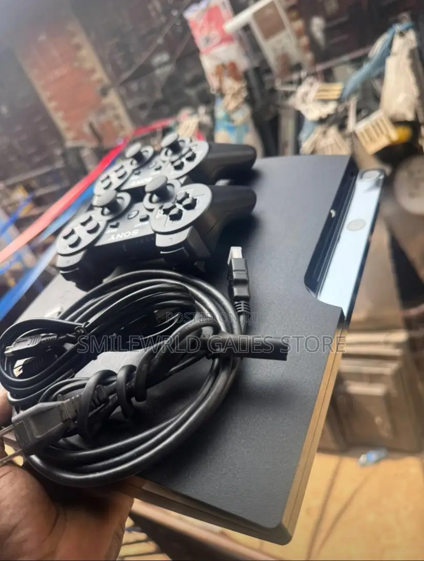 PS3 Slim With 2 Pads Plus 10 Games