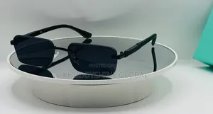 Black Rimless Rectangular Sunglasses Featuring Dark Tinted Lenses
