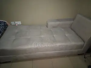 2 Sitters Chairs With Three Pillows.