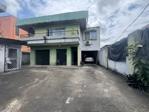 Land Measuring 557sqm With Duplex Structure on It at Ikeja